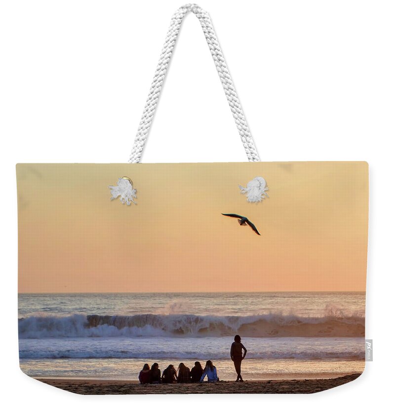 Ocean Waves Sunset Seagull People Sand Beach Weekender Tote Bag featuring the photograph Sunset Watch by Wendell Ward