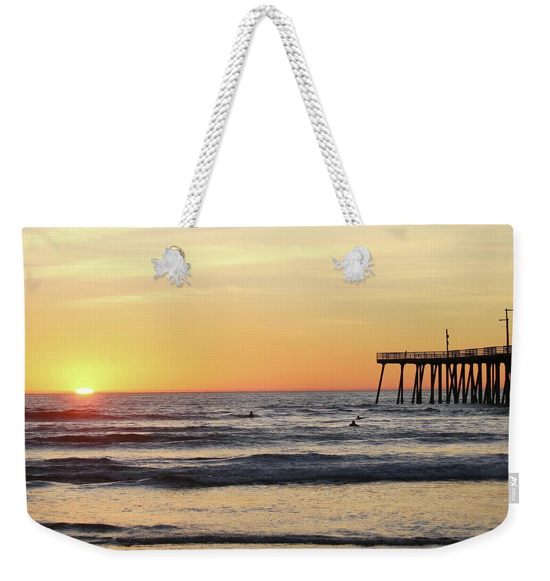 Pismo Beach Pier Weekender Tote Bag featuring the photograph Surfing in the Setting Sun by Art Block Collections