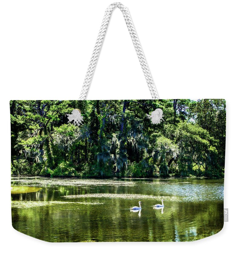 Color Weekender Tote Bag featuring the photograph Swans -1 by Alan Hausenflock