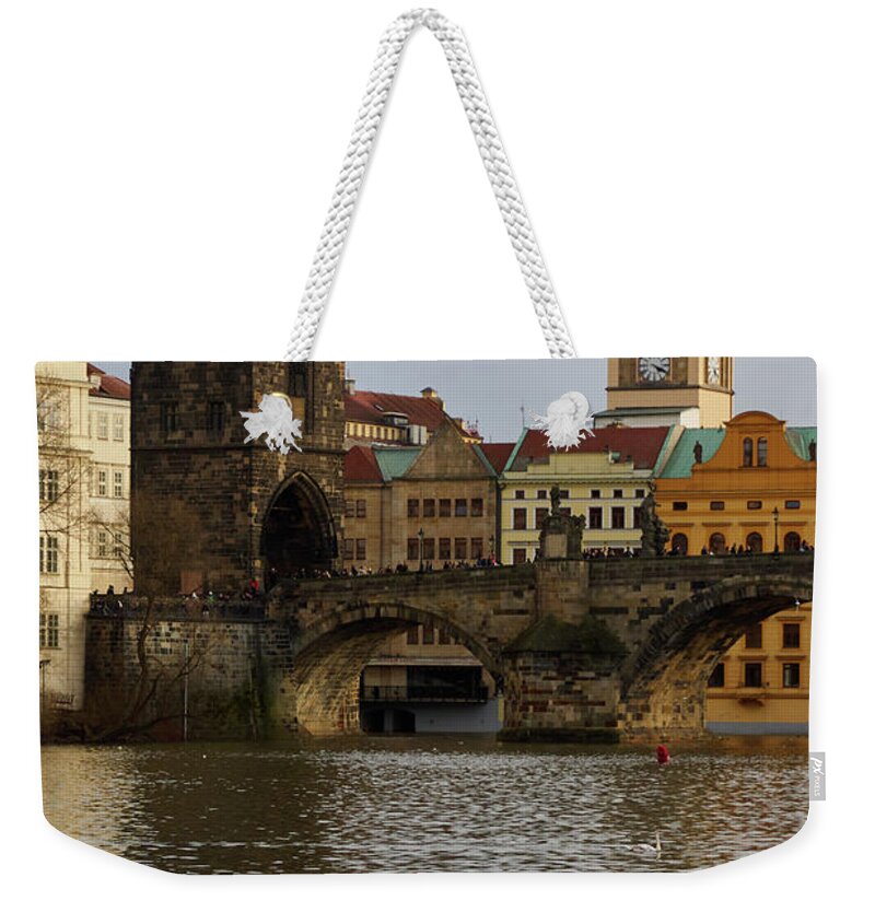 Finland Weekender Tote Bag featuring the photograph Swans By the Vltava. Prague spring 2017 by Jouko Lehto