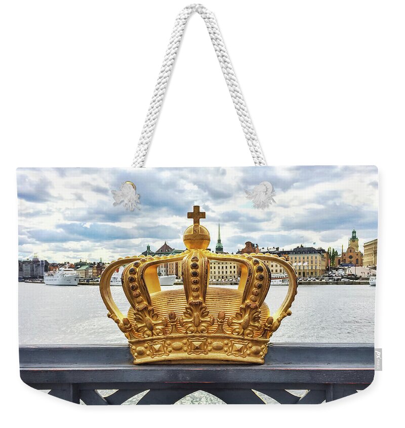 Stockholm Weekender Tote Bag featuring the photograph Swedish royal crown on a bridge in Stockholm by GoodMood Art