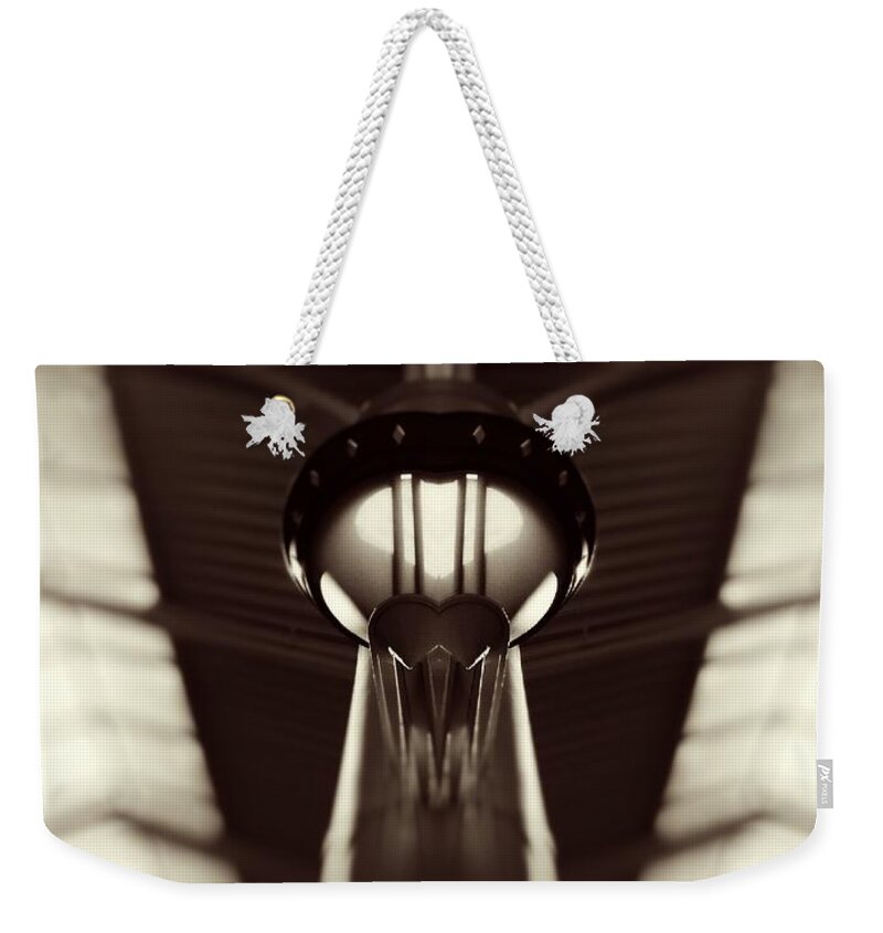 Sepia Weekender Tote Bag featuring the photograph Taking Off by Jenny Revitz Soper