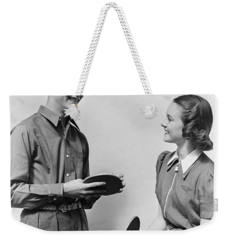 1940s Weekender Tote Bag featuring the photograph Teen Couple With Table Tennis Paddles by H. Armstrong Roberts/ClassicStock