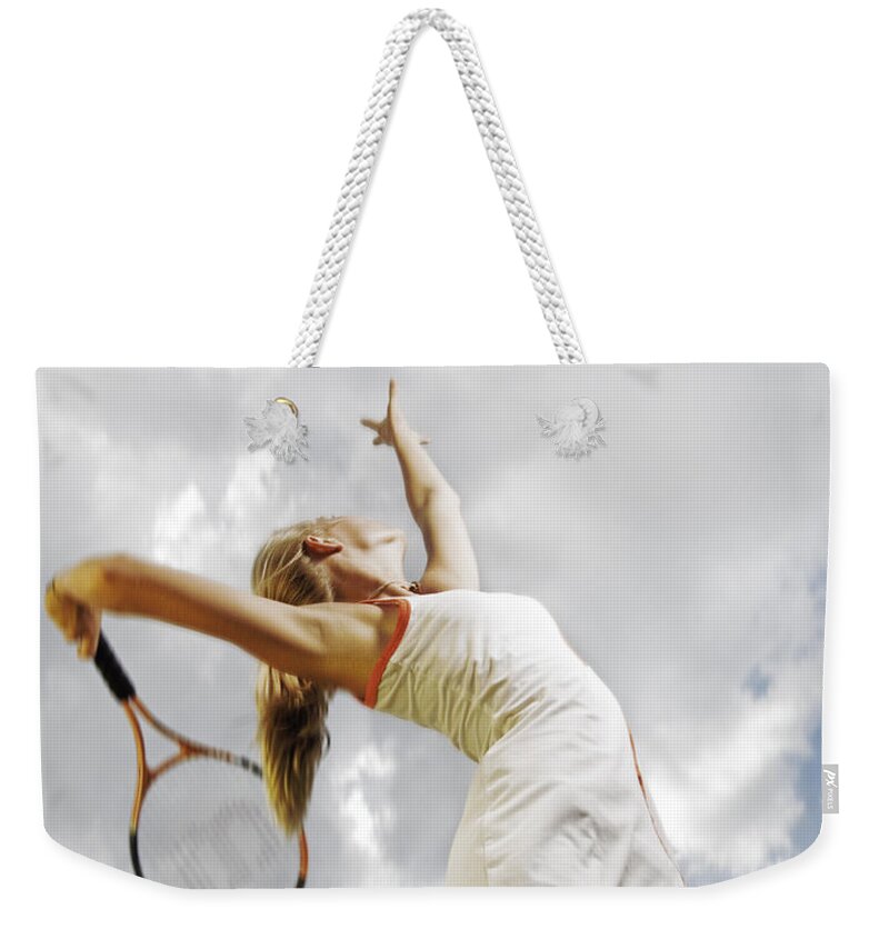 Woman Weekender Tote Bag featuring the photograph Tennis serve by Steve Williams