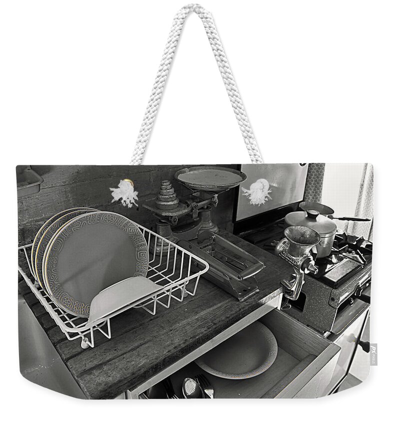 Welfare Weekender Tote Bag featuring the photograph The Art of Welfare. Kitchen cupboards. by Elena Perelman