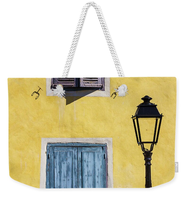 Door Weekender Tote Bag featuring the photograph The blue door by Paul MAURICE