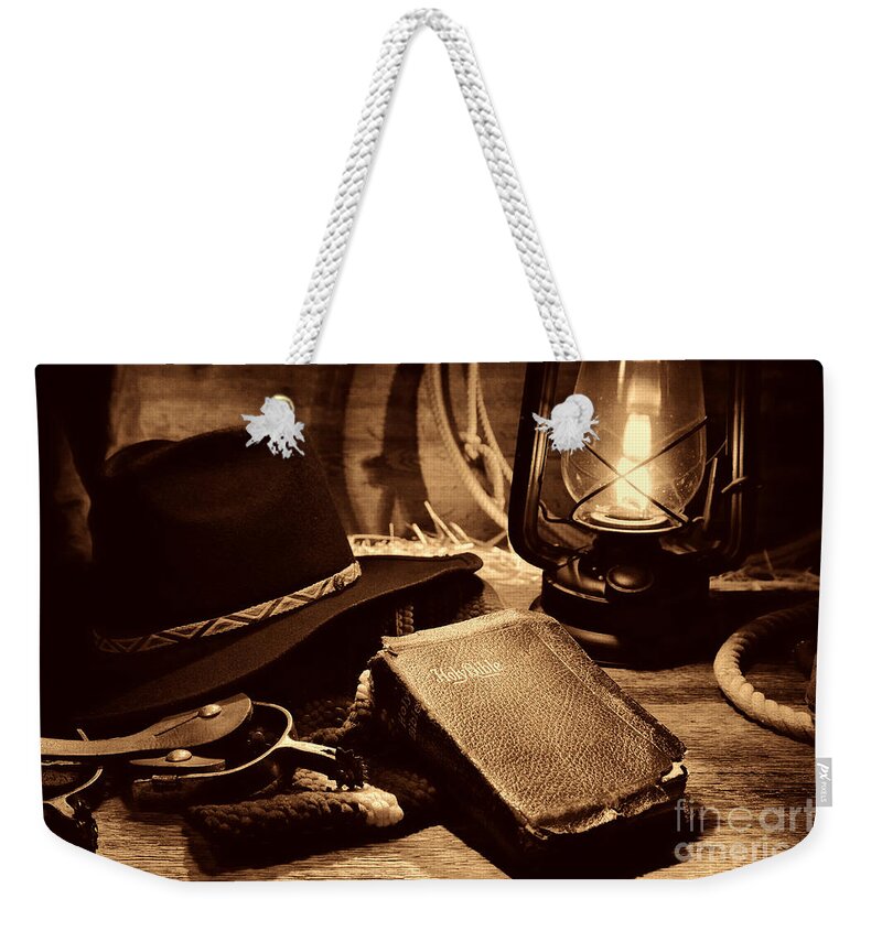 Antique Weekender Tote Bag featuring the photograph The Cowboy Bible by American West Legend By Olivier Le Queinec