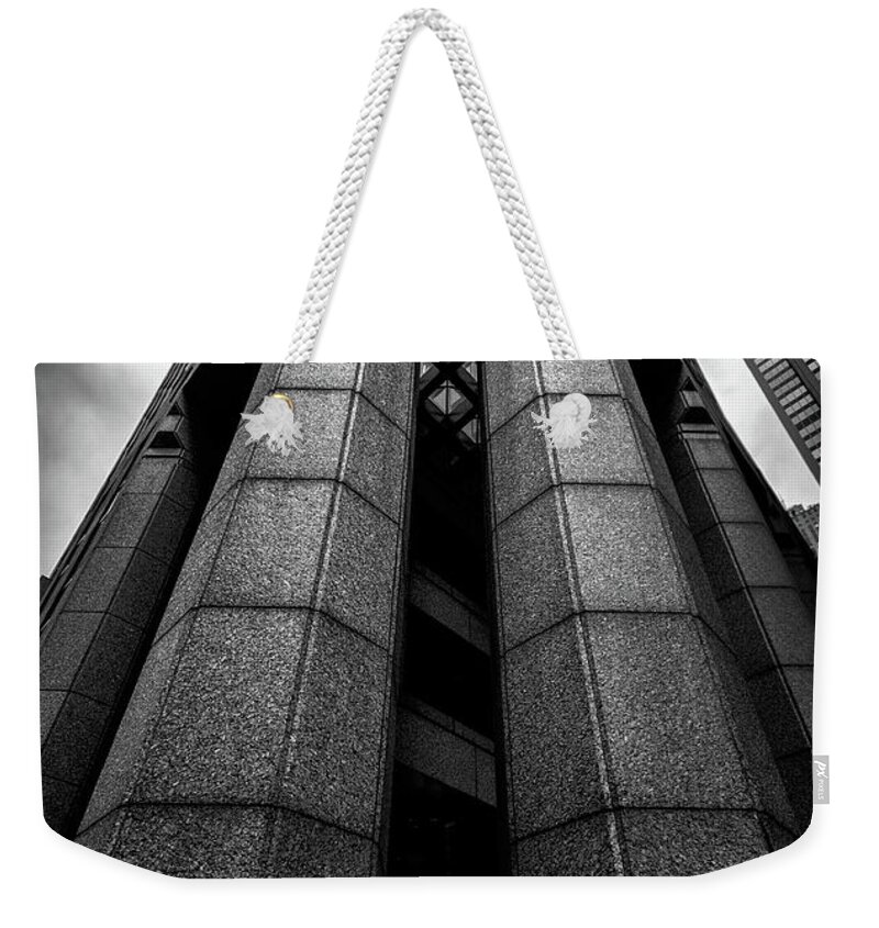 31 W 52nd Street Weekender Tote Bag featuring the photograph The Dark Tower by Neil Shapiro