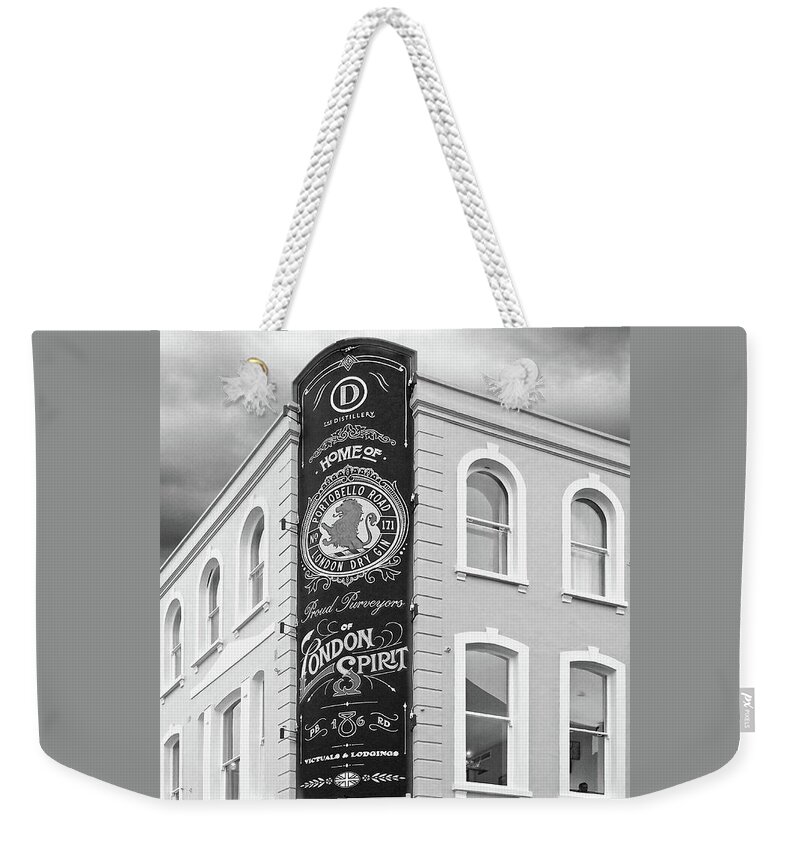 London Weekender Tote Bag featuring the photograph The Distillery Portobello Road London Spirit Gin House in Black and White by Gill Billington