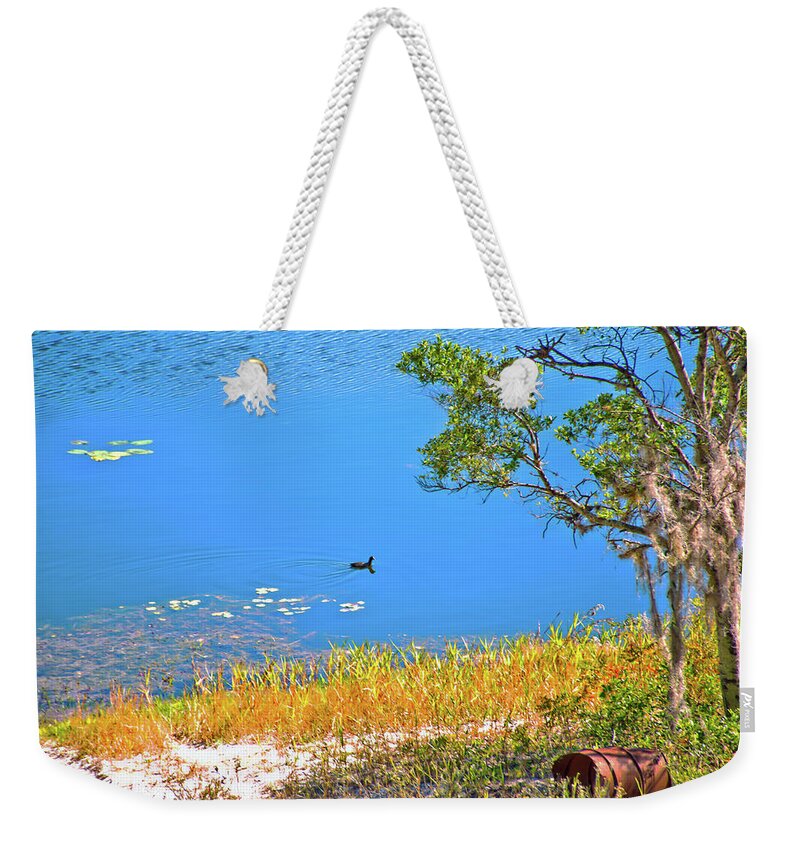 Lake Weekender Tote Bag featuring the photograph The Duck by Gina O'Brien