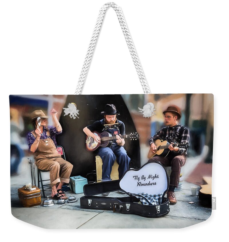 Buskers Weekender Tote Bag featuring the photograph The Fly By Night Rounders by John Haldane