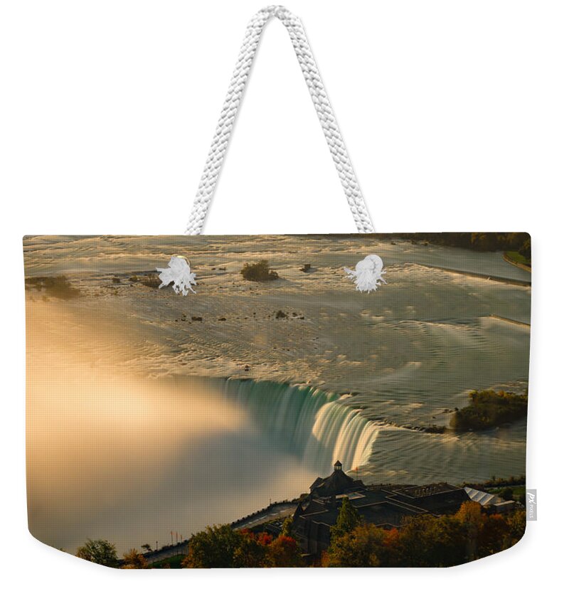 Niagara Falls Weekender Tote Bag featuring the photograph The Golden Mist of Niagara by Mark Rogers