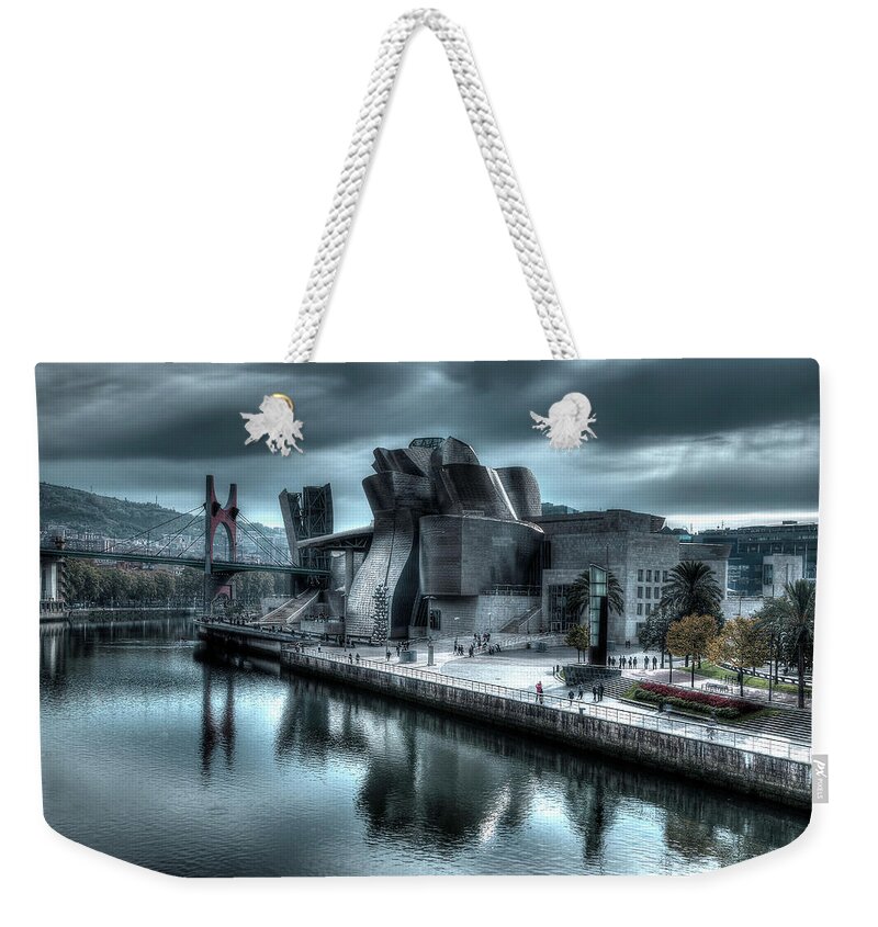 Spain Bilbao Guggenheim Museum Basque Country Frank Gehry Contemporary Architecture Nervion River City Daring And Innovative Curves Building Exterior Spectacular Building Deconstructivism Ferrovial Clad In Glass Weekender Tote Bag featuring the photograph The Guggenheim Museum Bilbao Surreal by Andy Myatt