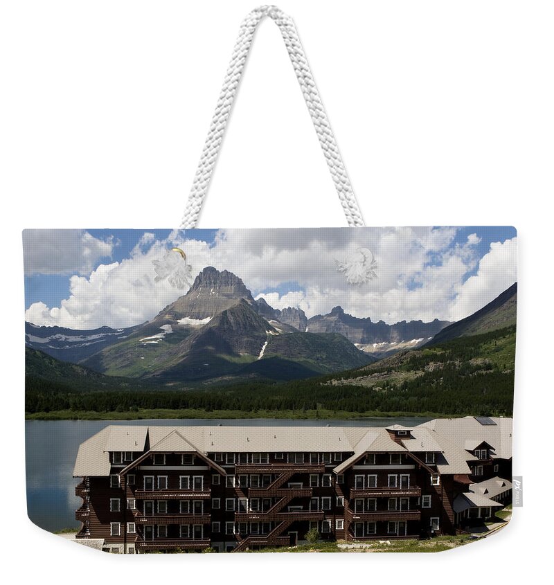 Many Glacier Lodge Weekender Tote Bag featuring the photograph The Hills Are Alive by Lorraine Devon Wilke