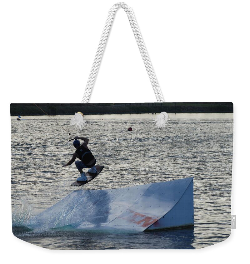 Waves Weekender Tote Bag featuring the photograph The Jumper by Rob Hans