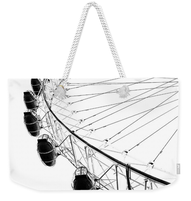 Black Weekender Tote Bag featuring the photograph The London Eye by Diana Rajala
