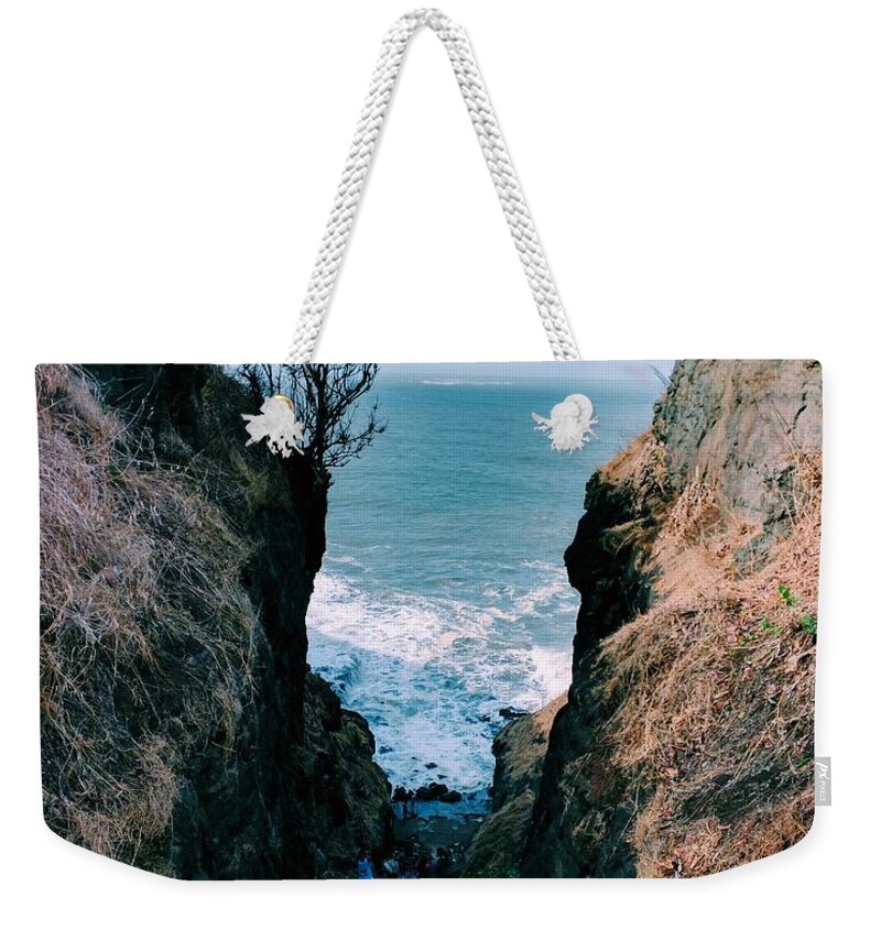  Weekender Tote Bag featuring the photograph The ocean by Omkar Shirke