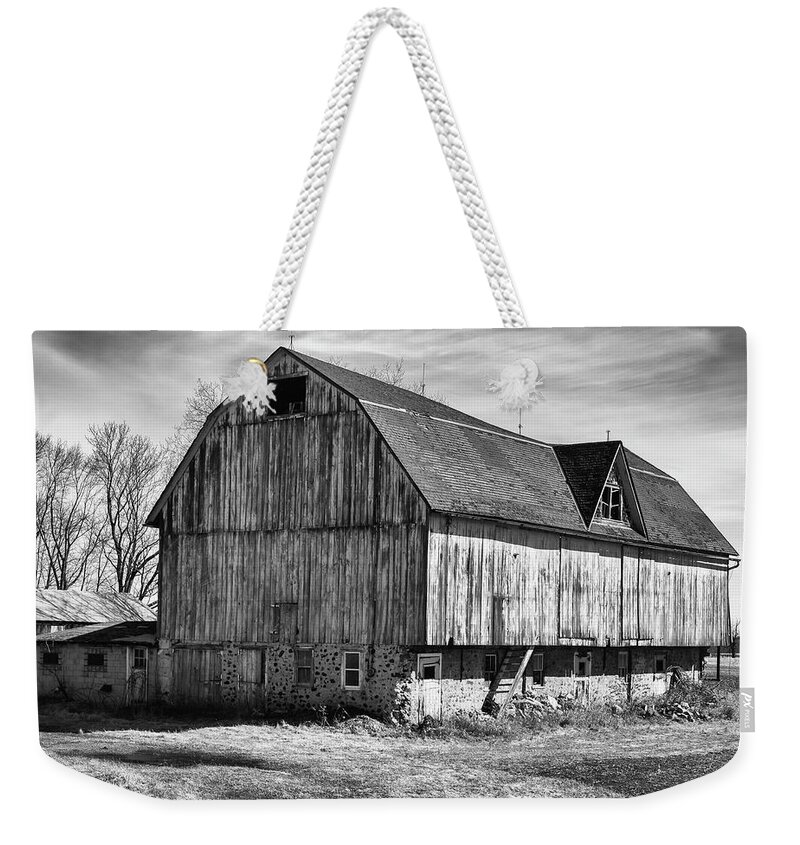 Monochrome Weekender Tote Bag featuring the photograph The Old Barn by John Roach
