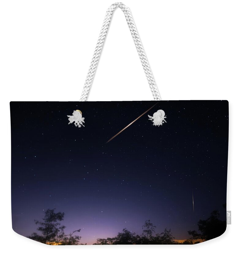 Meteor Shower Weekender Tote Bag featuring the photograph The Perseid Meteor Shower by Mark Andrew Thomas