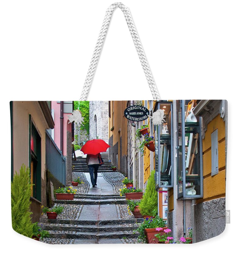 Red Umbrella Weekender Tote Bag featuring the photograph The Red Umbrella - Bellagio, Lake Como, Italy by Denise Strahm