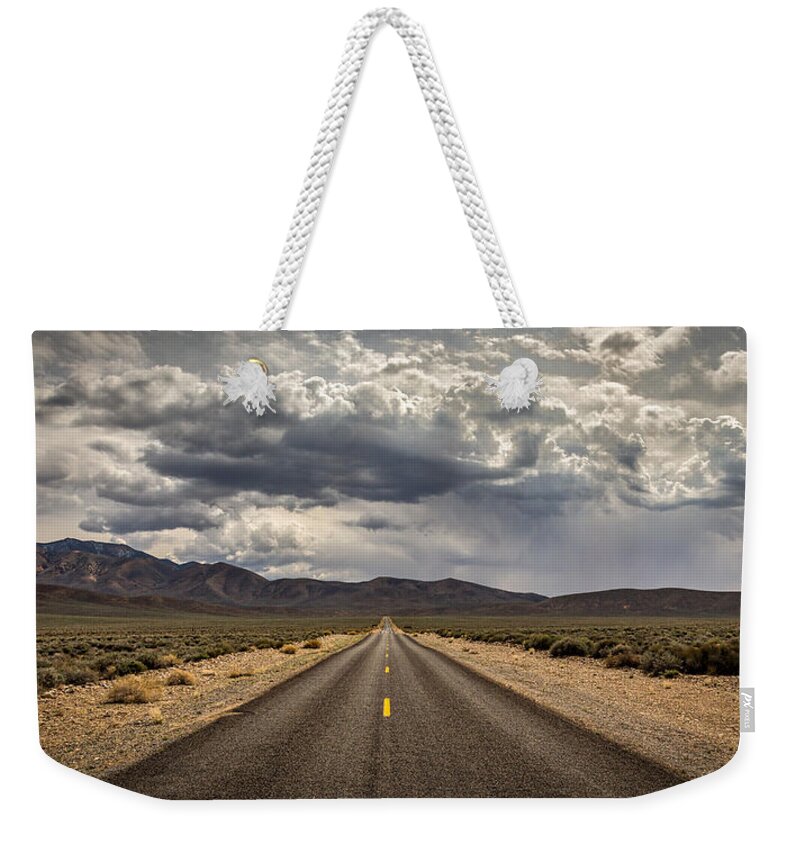 Big Sky Weekender Tote Bag featuring the photograph The Road to Death Valley by Peter Tellone