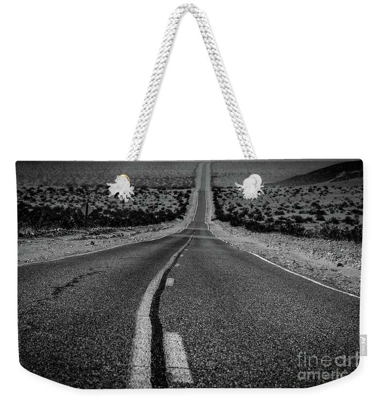 Death Valley Weekender Tote Bag featuring the photograph The Road to Shoshone by Jeff Hubbard