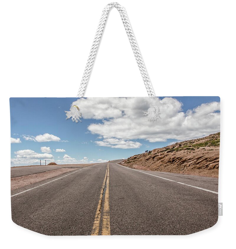 Architecture Weekender Tote Bag featuring the photograph The Road up Pikes Peak at around 12,000 feet by Peter Ciro