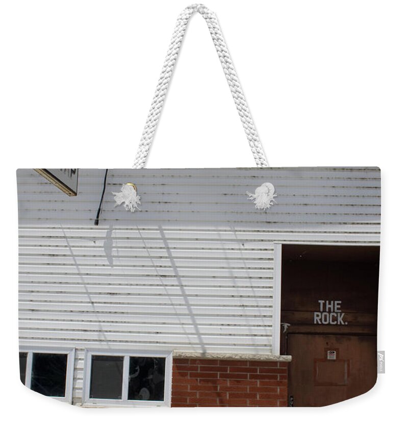 The Rock Bike Weekender Tote Bag featuring the photograph The Rock Bike by Dylan Punke