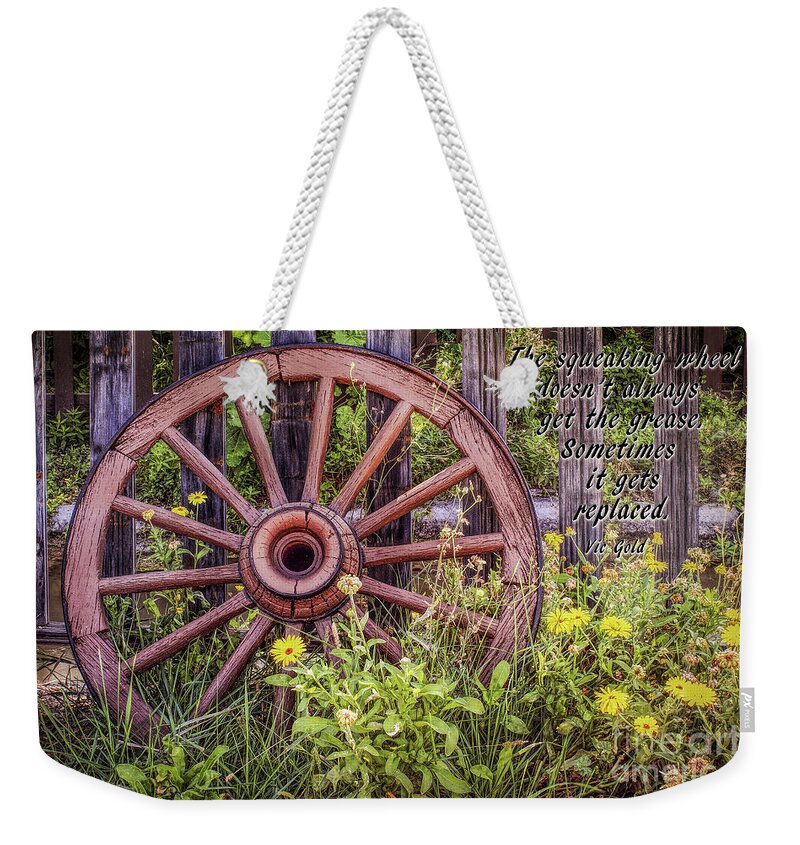 The Squeaking Wheel. Wagon Wheel Weekender Tote Bag featuring the photograph The Squeaking Wheel by Priscilla Burgers