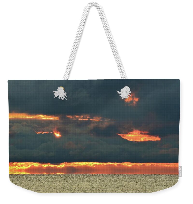 Abstract Weekender Tote Bag featuring the photograph The Sun Hiding In A Cloud by Lyle Crump