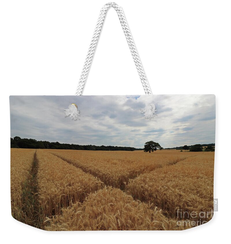 The Wheat Cross Overcast Skies Weekender Tote Bag featuring the photograph The wheat cross by Julia Gavin