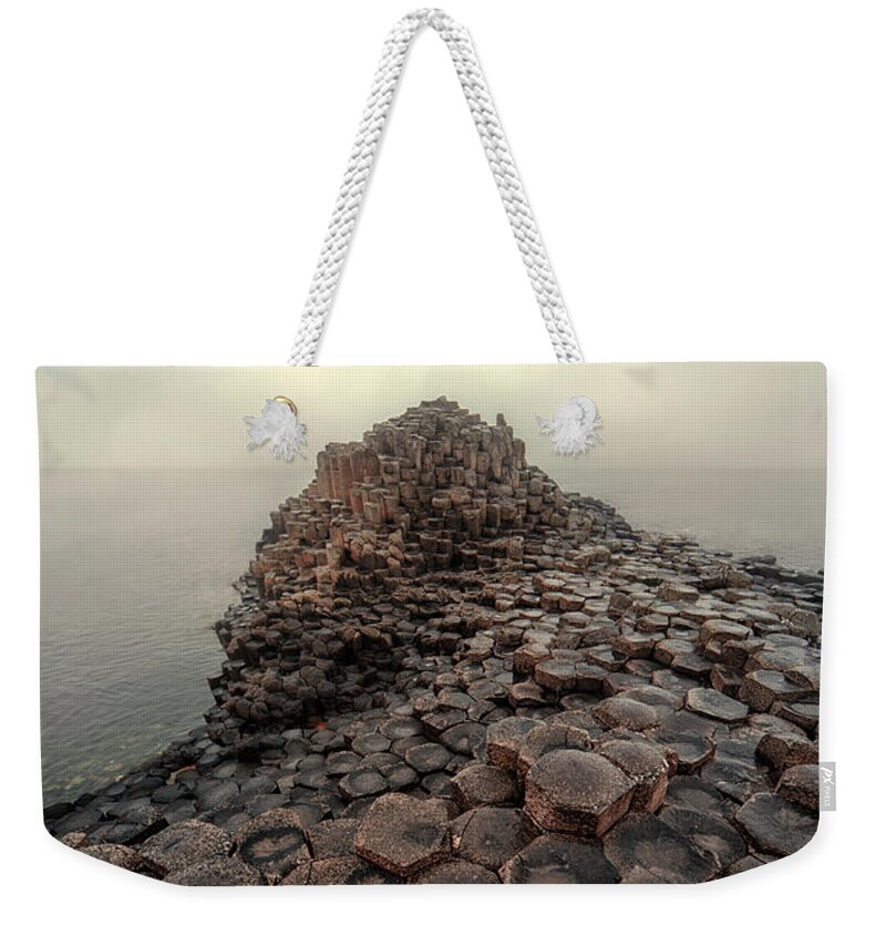 Giant Causeway Weekender Tote Bag featuring the photograph The world of hexagon stones by Jaroslaw Blaminsky