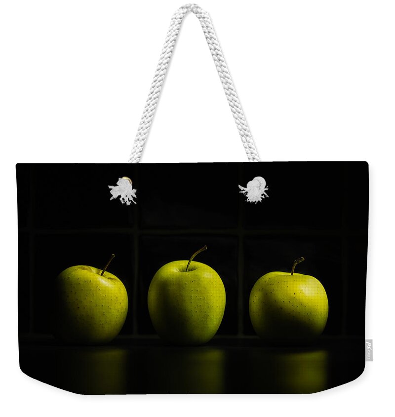 Apple Weekender Tote Bag featuring the photograph Three Apples by Nigel R Bell