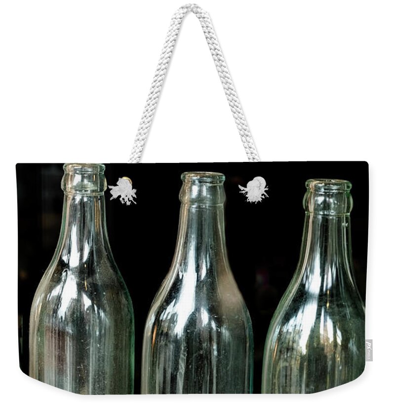 Whetstone Brook Weekender Tote Bag featuring the photograph Three Bottles by Tom Singleton