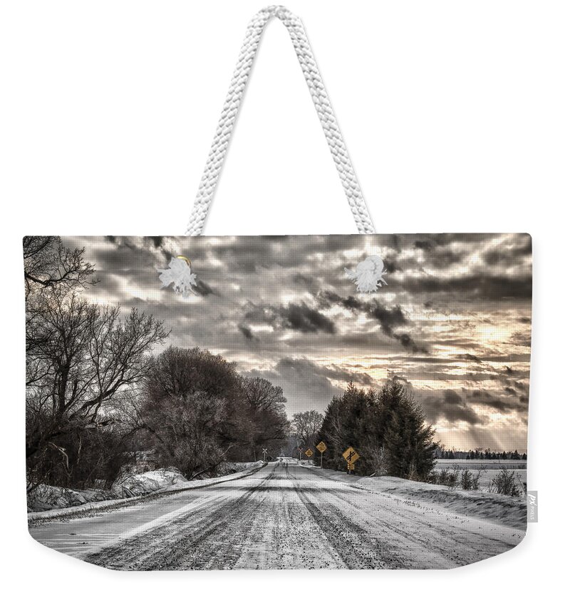 Winter Weekender Tote Bag featuring the photograph Through the snow by Eunice Gibb