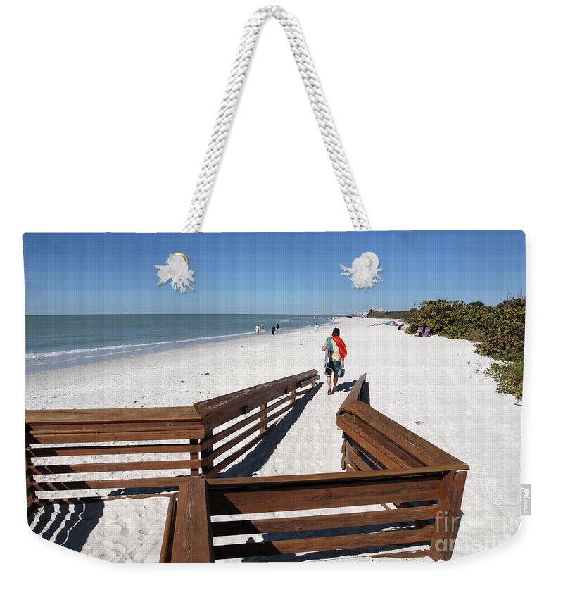 Beach Weekender Tote Bag featuring the photograph Tide of Sand over a ramp on the beach in Naples Florida by William Kuta