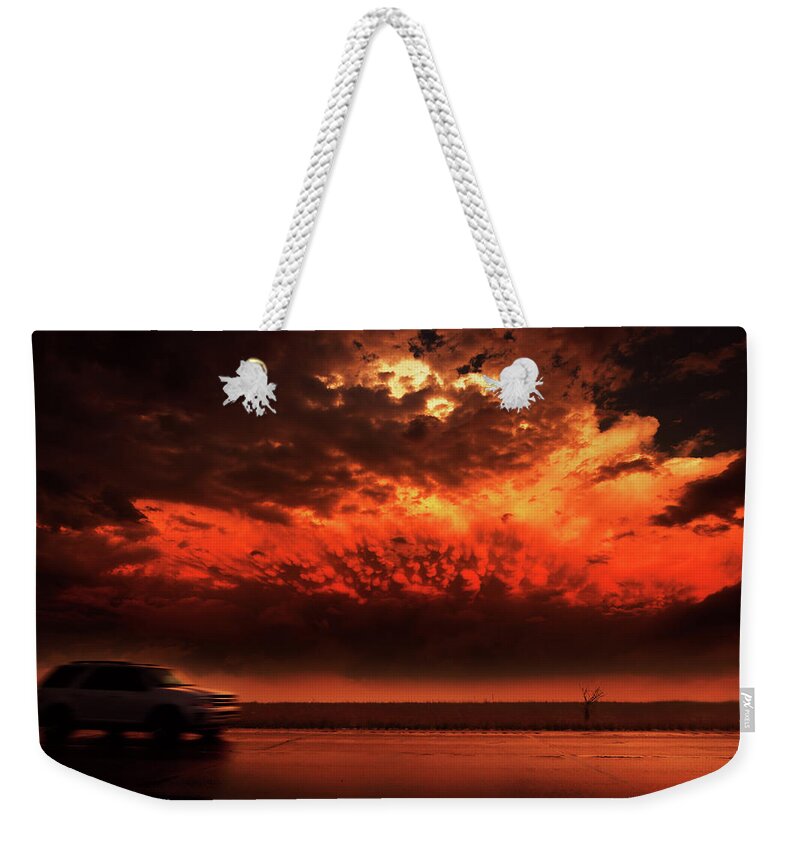 Riders Weekender Tote Bag featuring the photograph Riders On The Storm by Brian Gustafson