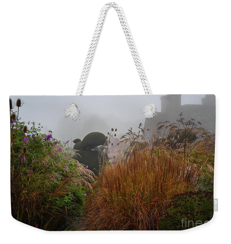 Topiary Weekender Tote Bag featuring the photograph Topiary Peacocks in the Autumn Mist, Great Dixter 2 by Perry Rodriguez