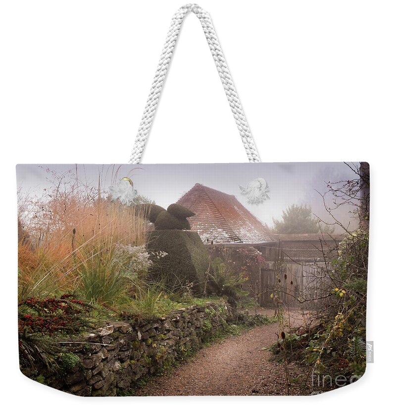 Topiary Weekender Tote Bag featuring the photograph Topiary Peacocks in the Autumn Mist, Great Dixter 3 by Perry Rodriguez