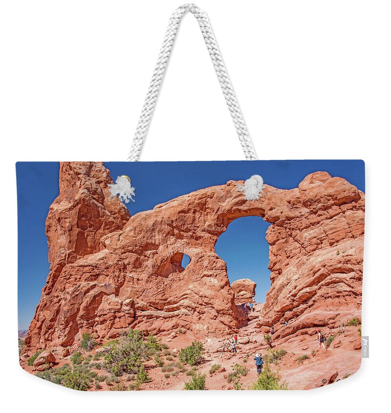 Moab Weekender Tote Bag featuring the photograph Tourists on Sandstone Arch Formation, Arches National Park by A Macarthur Gurmankin