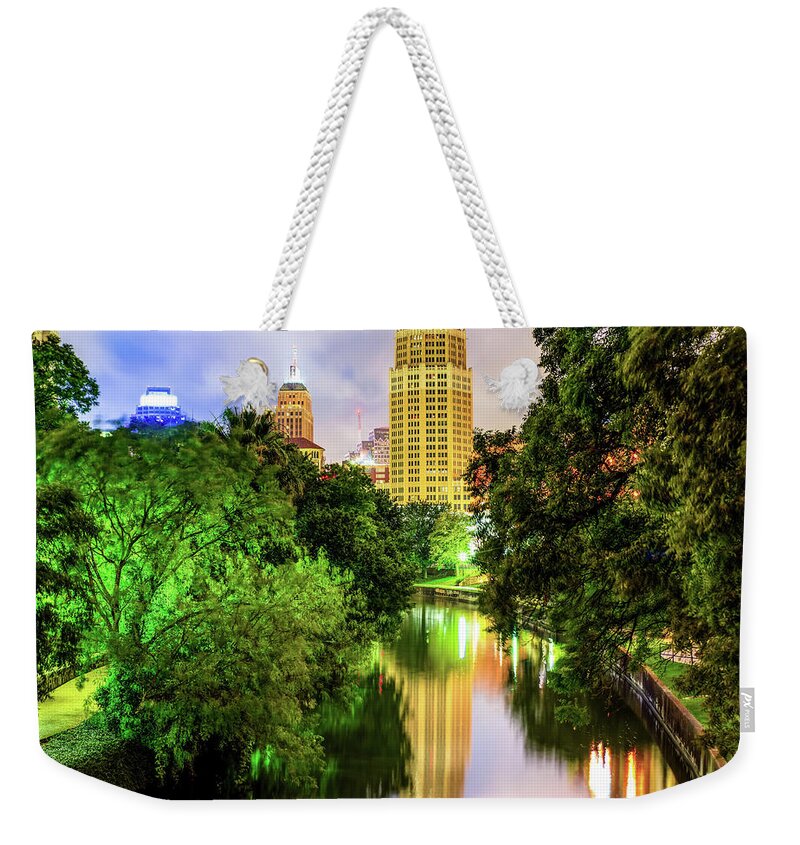 San Antonio Weekender Tote Bag featuring the photograph Tower Life Building Reflecting on the Riverwalk - San Antonio Texas by Gregory Ballos