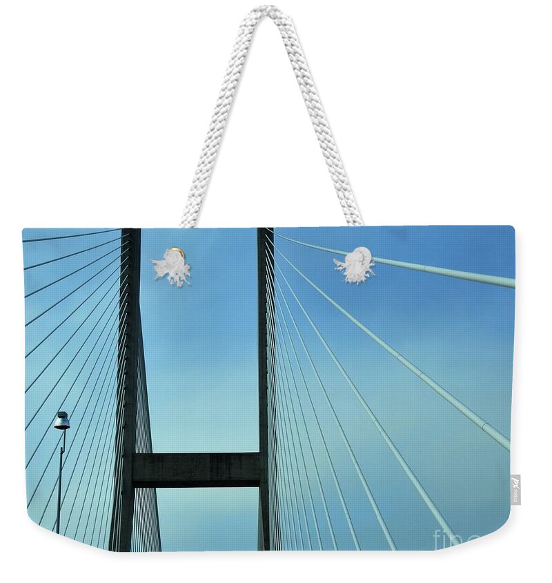Bridges Weekender Tote Bag featuring the photograph Towering Abstract by Jan Gelders
