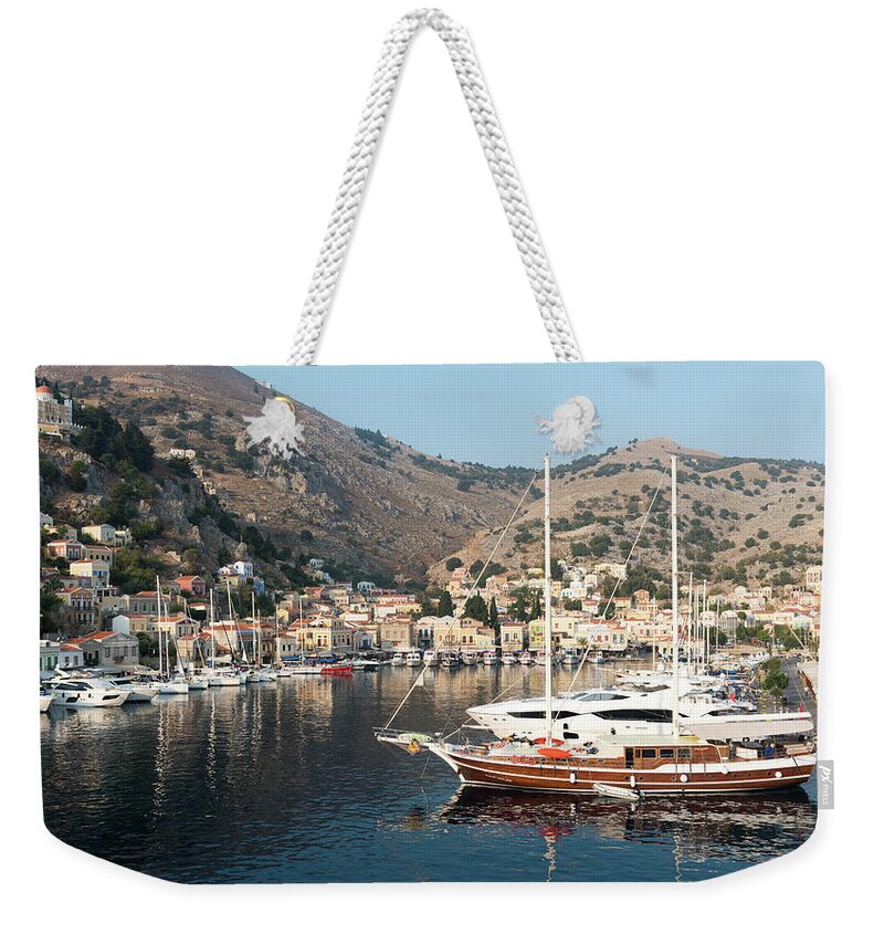 Symi Weekender Tote Bag featuring the photograph Town of Symi island Greece by Michalakis Ppalis