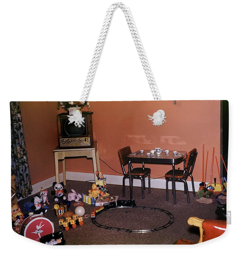 Table Weekender Tote Bag featuring the photograph Toys of Christmas Morning by Wernher Krutein