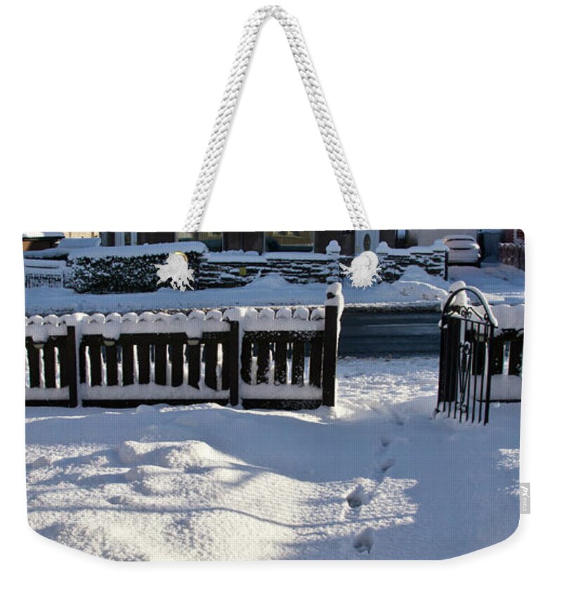 Snow Weekender Tote Bag featuring the photograph Traces on snow. by Elena Perelman