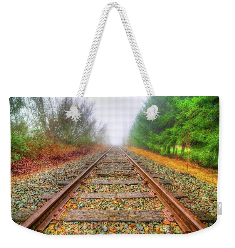Foggy Morning Weekender Tote Bag featuring the photograph Tracks Through My Heart by Spencer McDonald