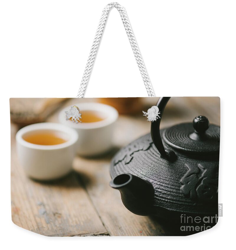 Tea Weekender Tote Bag featuring the photograph Traditional asian tea by Jelena Jovanovic