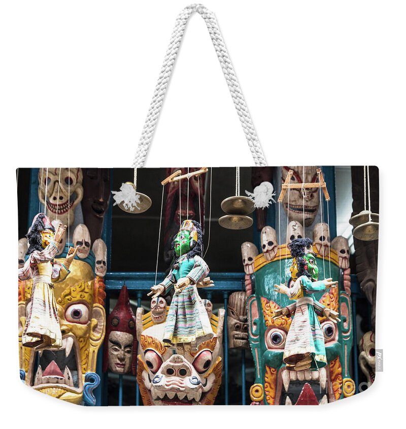 Indian Subcontinent Weekender Tote Bag featuring the photograph Traditional Nepalese masks and puppets in Kathmandu by Didier Marti