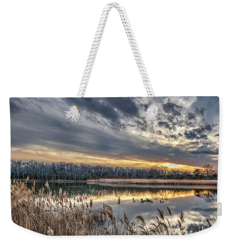 Geese Weekender Tote Bag featuring the photograph Tranquil Chesapeake Bay pond during Winter at sunset by Patrick Wolf