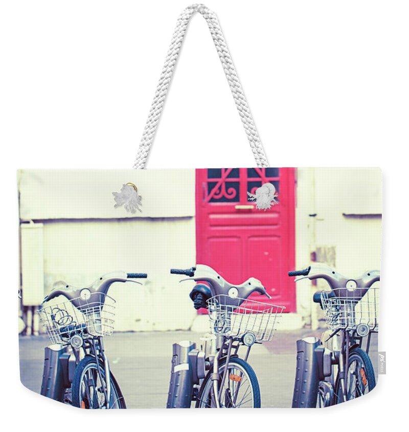 Paris Photography Weekender Tote Bag featuring the photograph Trois - Three Bicycles in Paris by Melanie Alexandra Price